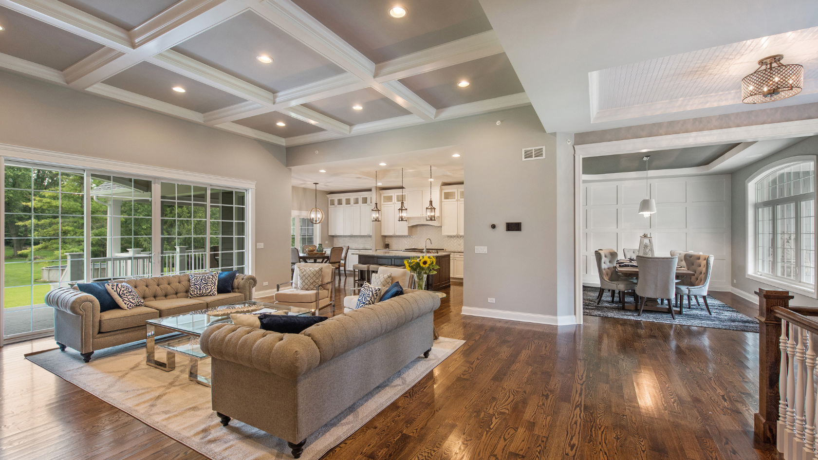 A living room filled with furniture and a wooden floor